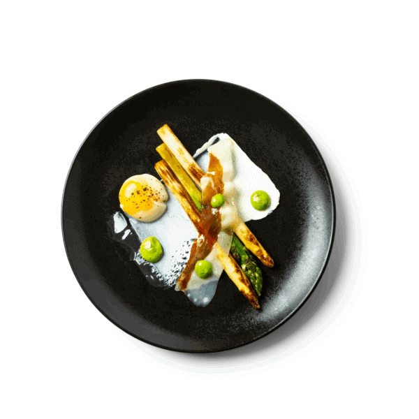 Grilled asparagus with bacon chips, shoyu egg and goat's cream cheese